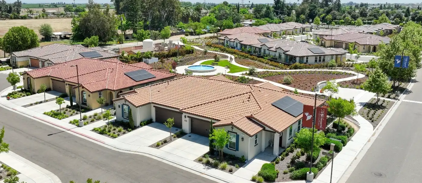 Overhead photo of Duplex Villas, which feature solar panels and single-car garages.